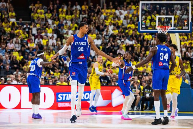 France's power forward #32 Victor Wembanyama celebrates with France's forward #34 Jaylen Hoard during the FIBA 2027 World Cup qualifying basketball match, 2nd round Group L, between Sweden and France at Avicii Arena in Stockholm, on August 30, 2026. (Photo by Jonathan NACKSTRAND / AFP)