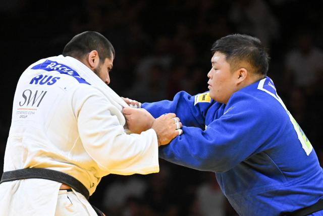 Russia's Tamerlan Bashaev (white) and Japan's Kanta Nakano compete in the men's above 100kg bronze medal bout at the Lausanne Grand Slam judo tournament, part of the IJF World Judo Tour, in Prilly on August 30, 2026. (Photo by Fabrice COFFRINI / AFP)