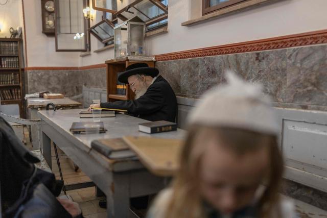 An ultra-Orthodox Jewish man prays inside a synagogue at the Mea Shearim neighbourhood in Jerusalem on August 30, 2026. (Photo by ilia YEFIMOVICH / AFP)