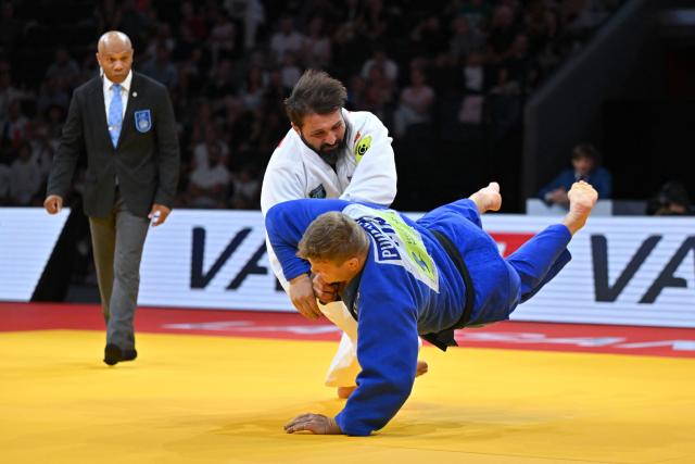 Russia's Inal Tasoev (white) and Finland's Martti Puumalainen compete in the men's above 100kg gold medal bout at the Lausanne Grand Slam judo tournament, part of the IJF World Judo Tour, in Prilly on August 30, 2026. (Photo by Fabrice COFFRINI / AFP)