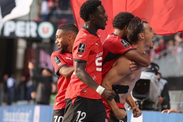 Rennes' French forward #09 Esteban Lepaul (R) celebrates scoring his team's third goal during the French L1 football match between Stade Rennais FC and Le Mans FC at the Roazhon Park stadium in Rennes, western France, on August 30, 2026. (Photo by Alain JOCARD / AFP)