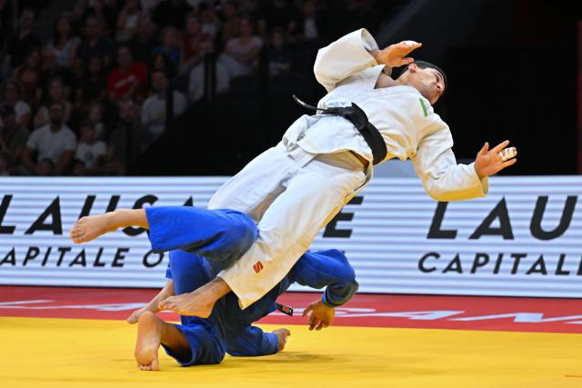 Uzbekistan's Nurbek Murtozoev (white) and Uzbekistan's Umar Bozorov compete in the men's under 90kg gold  medal bout at the Lausanne Grand Slam judo tournament, part of the IJF World Judo Tour, in Prilly on August 30, 2026. (Photo by Fabrice COFFRINI / AFP)