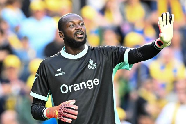 Union SG's Burkinabe goalkeeper #12 Herve Koffi reacts during the Belgian "Pro League" First Division football match between Union Saint-Gilloise and RSC Anderlecht at Stade Joseph Marien in Brussels on August 30, 2026. (Photo by JILL DELSAUX / Belga / AFP) / Belgium OUT