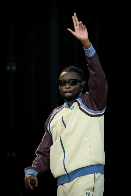 French rapper, singer and footballer Guy Kapata, known as Guy2Bezbar, performs at the Goldencoast Rap Festival in Corcelles-les-Monts, near Dijon, central-eastern France, on August 30, 2026. (Photo by ARNAUD FINISTRE / AFP)