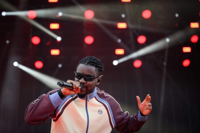 French rapper, singer and footballer Guy Kapata, known as Guy2Bezbar, performs at the Goldencoast Rap Festival in Corcelles-les-Monts, near Dijon, central-eastern France, on August 30, 2026. (Photo by ARNAUD FINISTRE / AFP)