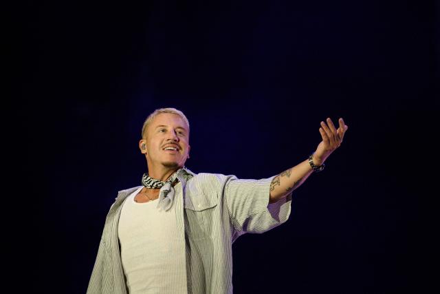 US rapper, singer, dancer and DJ, Benjamin Haggerty, known as Macklemore, performs at the Goldencoast Rap Festival in Corcelles-les-Monts, near Dijon, central-eastern France, on August 30, 2026. (Photo by ARNAUD FINISTRE / AFP)