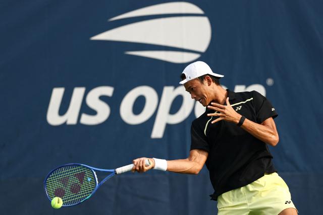 Japan's Rei Sakamoto serves to Australia's Aleksandar Vukic during their men's singles first round tennis match on day one of the US Open tennis tournament at the USTA Billie Jean King National Tennis Center in New York on August 30, 2026. (Photo by CHARLY TRIBALLEAU / AFP)