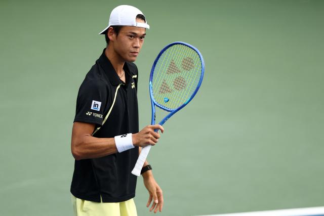 Japan's Rei Sakamoto reacts as he plays Australia's Aleksandar Vukic during their men's singles first round tennis match on day one of the US Open tennis tournament at the USTA Billie Jean King National Tennis Center in New York on August 30, 2026. (Photo by CHARLY TRIBALLEAU / AFP)