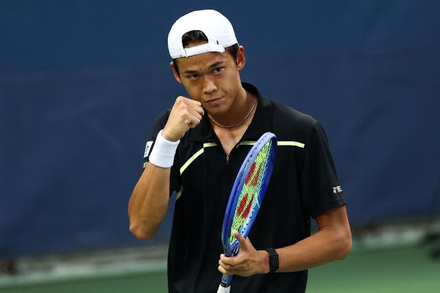 Japan's Rei Sakamoto celebrates during a match against Australia's Aleksandar Vukic during the men's singles first round tennis match on day one of the US Open tennis tournament at the USTA Billie Jean King National Tennis Center in New York City on August 30, 2026. (Photo by CHARLY TRIBALLEAU / AFP)