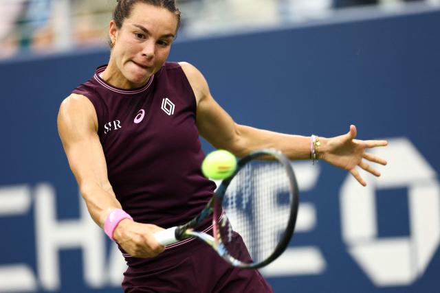 France's Lois Boisson hits a backhand against USA’s Emma Navarro during the women's singles first round tennis match on day one of the US Open tennis tournament at the USTA Billie Jean King National Tennis Center in New York City on August 30, 2026. (Photo by CHARLY TRIBALLEAU / AFP)