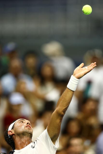 Argentina's Thiago Agustin Tirante serves against France's Adrian Mannarino during the men's singles first round tennis match on day one of the US Open tennis tournament at the USTA Billie Jean King National Tennis Center in New York City on August 30, 2026. (Photo by CHARLY TRIBALLEAU / AFP)