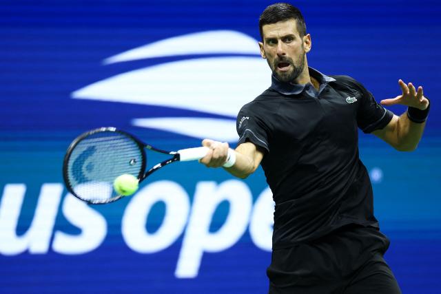 Serbia's Novak Djokovic returns a shot against Argentina's Mariano Navone during the men's singles first round tennis match on day one of the US Open tennis tournament at the USTA Billie Jean King National Tennis Center in New York City on August 30, 2026. (Photo by CHARLY TRIBALLEAU / AFP)