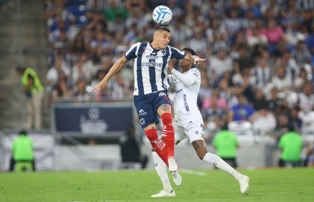 Monterrey's Montenegrin forward #32 Uros Djurdevic and San Luis' defender #03 Robson Bambu fight for the ball during the Liga MX Apertura tournament football match between Monterrey and San Luis, at BBVA stadium in Guadalupe, state of Nuevo Leon, Mexico on August 30, 2026. (Photo by Julio Cesar AGUILAR / AFP)