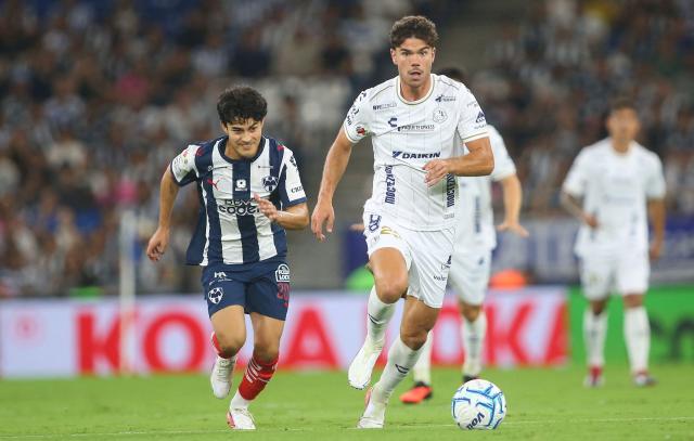 Monterrey's midfielder #200 Omar Galvez and San Luis' Spain forward #22 Rafa Llorente fight for the ball during the Liga MX Apertura tournament football match between Monterrey and San Luis, at BBVA stadium in Guadalupe, state of Nuevo Leon, Mexico on August 30, 2026. (Photo by Julio Cesar AGUILAR / AFP)