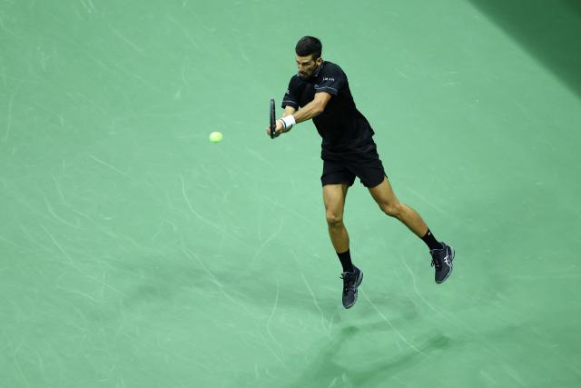 Serbia's Novak Djokovic hits a backhand against Argentina's Mariano Navone during the men's singles first round tennis match on day one of the US Open tennis tournament at the USTA Billie Jean King National Tennis Center in New York City on August 30, 2026. (Photo by CHARLY TRIBALLEAU / AFP)