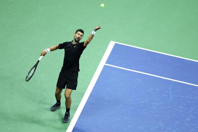 Serbia's Novak Djokovic serves against Argentina's Mariano Navone during the men's singles first round tennis match on day one of the US Open tennis tournament at the USTA Billie Jean King National Tennis Center in New York City on August 30, 2026. (Photo by CHARLY TRIBALLEAU / AFP)