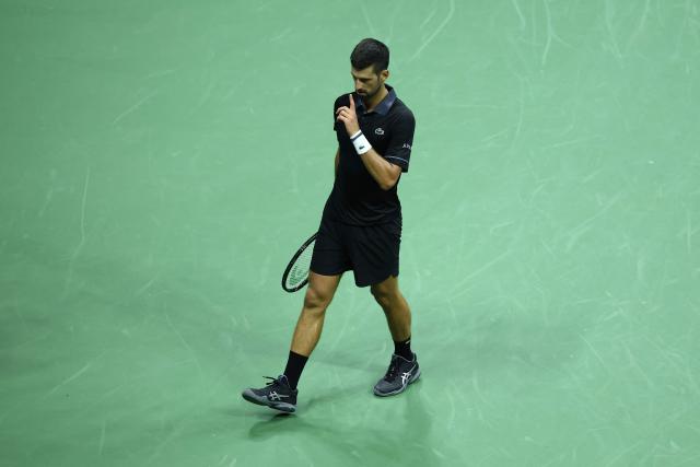 Serbia's Novak Djokovic reacts during a match against Argentina's Mariano Navone during the men's singles first round tennis match on day one of the US Open tennis tournament at the USTA Billie Jean King National Tennis Center in New York City on August 30, 2026. (Photo by CHARLY TRIBALLEAU / AFP)