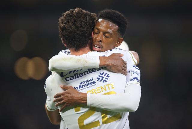 San Luis' Spain forward #22 Rafa Llorente celebrates with teammate defender #03 Robson Bambu after scoring his team's second goal during the Liga MX Apertura tournament football match between Monterrey and San Luis, at BBVA stadium in Guadalupe, state of Nuevo Leon, Mexico on August 30, 2026. (Photo by Julio Cesar AGUILAR / AFP)