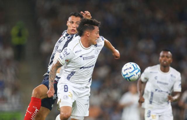 Monterrey's forward #27 Roberto de la Rosa and San Luis' defender #31 Eduardo Aguila fight for the ball during the Liga MX Apertura tournament football match between Monterrey and San Luis, at BBVA stadium in Guadalupe, state of Nuevo Leon, Mexico on August 30, 2026. (Photo by Julio Cesar AGUILAR / AFP)