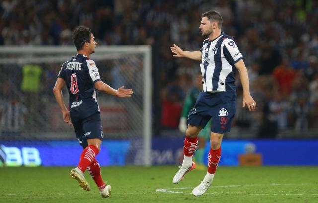 Monterrey's Belgian forward #99 Hugo Cuypers celebrates with teammate Spanish midfielder #08 Oliver Torres after scoring his team's first goal during the Liga MX Apertura tournament football match between Monterrey and San Luis, at BBVA stadium in Guadalupe, state of Nuevo Leon, Mexico on August 30, 2026. (Photo by Julio Cesar AGUILAR / AFP)