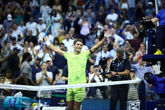 Argentina's Mariano Navone celebrates after upsetting Serbia's Novak Djokovic during the men's singles first round tennis match on day one of the US Open tennis tournament at the USTA Billie Jean King National Tennis Center in New York City on August 30, 2026. (Photo by CHARLY TRIBALLEAU / AFP)