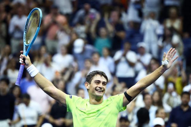 Argentina's Mariano Navone celebrates after upsetting Serbia's Novak Djokovic during the men's singles first round tennis match on day one of the US Open tennis tournament at the USTA Billie Jean King National Tennis Center in New York City on August 30, 2026. (Photo by CHARLY TRIBALLEAU / AFP)