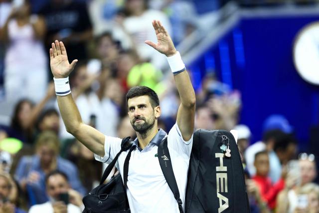 Serbia's Novak Djokovic waves to the crowd after losing the match against Argentina's Mariano Navone during the men's singles first round tennis match on day one of the US Open tennis tournament at the USTA Billie Jean King National Tennis Center in New York City on August 30, 2026. (Photo by CHARLY TRIBALLEAU / AFP)