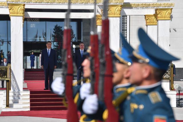 Kyrgyzstan's President Sadyr Japarov and China's President Xi Jinping attend a welcoming ceremony prior to their talks in Bishkek on August 31, 2026. (Photo by Vyacheslav OSELEDKO / AFP)