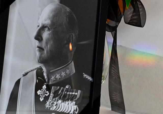 A portrait of late Norwegian King Harald V adorned with a black mourning ribbon is on display at the Royal Norwegian Embassy in Berlin, on August 31, 2026. King Harald V of Norway, who died on August 28, 2026 aged 89, remained a unifying figure in his country until the very end, a pillar of stability amid a string of family scandals that tarnished the final years of his reign. (Photo by Tobias SCHWARZ / AFP)
