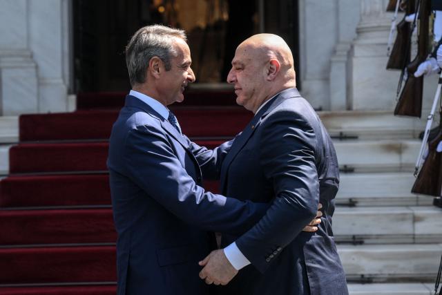 Greek Prime Minister Kyriakos Mitsotakis (L) welcomes Lebanese President Joseph Aoun (R) prior their meeting at the Maximos Mansion in Athens, on August 31, 2026. (Photo by Angelos TZORTZINIS / AFP)