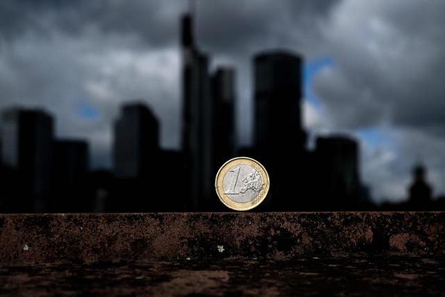 This illustration picture taken on August 31, 2026 in Frankfurt am Main, western Germany, shows a one Euro coin of Europe's Euro currency in front of banking district skyline. (Photo by Kirill KUDRYAVTSEV / AFP)
