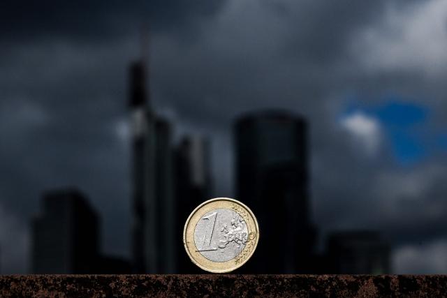 This illustration picture taken on August 31, 2026 in Frankfurt am Main, western Germany, shows a one Euro coin of Europe's Euro currency in front of banking district skyline. (Photo by Kirill KUDRYAVTSEV / AFP)