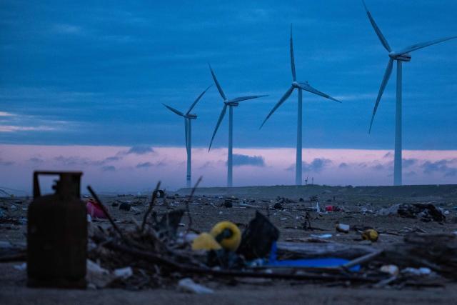 Debris are seen in front of wind turbines at Nikkawahama Beach as in Kamisu city, Ibaraki prefecture on August 31, 2026. (Photo by Philip FONG / AFP)