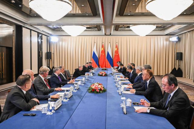 In this pool photograph distributed by the Russian state agency Sputnik, Russia's President Vladimir Putin and China's President Xi Jinping hold a meeting on the sidelines of the Shanghai Cooperation Organisation (SCO) summit in Bishkek on August 31, 2026. (Photo by Kristina Solovyova / POOL / AFP)