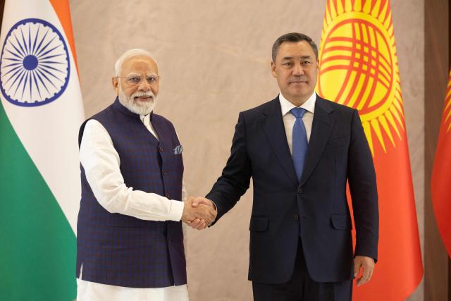 India’s Prime Minister Narenda Modi (L) is greeted by Kyrgyzstan's President Sadyr Japarov during the expanded meeting of the Council of Heads of State of the Shanghai Cooperation Organisation (SCO) member states at the Presidential Palace in Bishkek, Kyrgyzstan on August 31, 2026. (Photo by BYAMBASUREN BYAMBA-OCHIR / AFP)