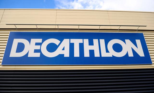 (FILES) This photograph shows a logo of a Decathlon store in the French northern city of Villeneuve d'Ascq on February 25, 2014. Decathlon announced on August 31, 2026 that it intends to acquire a 50% stake in Sport 2000 France, a move bringing together two competitors that could reshape the sports equipment market, which was already shaken up by Intersport’s acquisition of Go Sport stores in 2023. (Photo by Philippe HUGUEN / AFP)