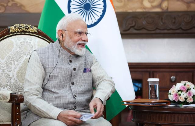 In this pool photograph distributed by the Russian state agency Sputnik, Indian Prime Minister Narendra Modi attends a meeting with Russia's President on the sidelines of the Shanghai Cooperation Organisation (SCO) summit in Bishkek on August 31, 2026. (Photo by Peter KOVALEV / POOL / AFP)