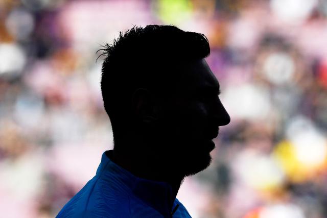 (FILES) Barcelona's Argentinian forward Lionel Messi is silhouetted as he warms up before the Spanish League football match between FC Barcelona and RCD Espanyol at the Camp Nou stadium in Barcelona on March 30, 2019. Argentine football player Lionel Messi said on August 31, 2026, he is retiring from international football after leading Argentina to a second successive World Cup final. (Photo by LLUIS GENE / AFP)