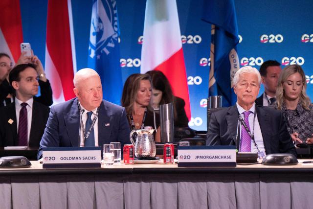 Goldman Sachs CEO David Solomon (L) and JPMorgan Chase CEO Jamie Dimon attend the G20 Finance Ministers and Central Bank Governors’ meeting in Asheville, North Carolina, on August 31, 2026. (Photo by Allison Joyce / AFP)
