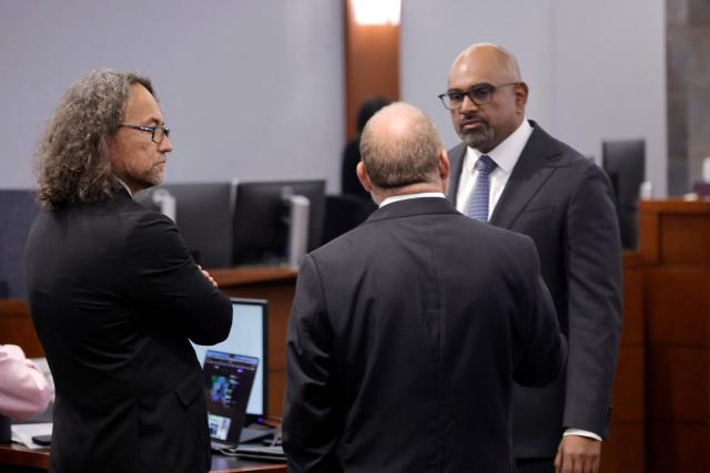 Defense attorney Michael Sanft (L) and Chief Deputy District Attorneys Marc DiGiacomo (C) and Chief Deputy District Attorney Binu Palal confer in the courtroom before closing arguments in the Duane Davis murder triall, related to the 1996 killing of rapper Tupac Shakur, at Clark County District Court at the Regional Justice Center in Las Vegas, Nevada, on August 31, 2026. The trial of the former gang leader accused of orchestrating the murder of rapper Tupac Shakur began on August 10, 30 years after one of America's most high-profile unresolved killings. The proceedings, expected to last a month, will likely not make clear who fired the shots that killed the California hip-hop legend on the night of September 7, 1996, while he was in Las Vegas to see a Mike Tyson boxing match. (Photo by STEVE MARCUS / POOL / AFP)
