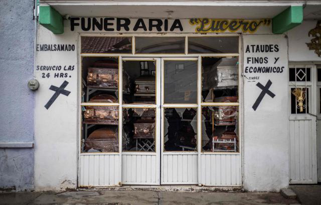 A funeral service building damaged by a car bomb explosion is pictured outside the municipal police station in Ojocaliente, Zacatecas, Mexico, on August 31, 2026. A car bomb exploded on August 30 night in front of a police station in Mexico, wounding six people, authorities said. The attack took place in the state of Zacatecas, which has key routes for drug trafficking. (Photo by Jess Mireles / AFP)