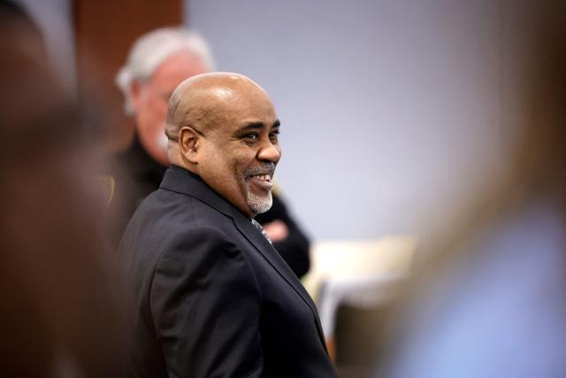 Duane Davis smiles during a break during closing arguments in his murder trial, related to the 1996 killing of rapper Tupac Shakur, at Clark County District Court at the Regional Justice Center in Las Vegas, Nevada, on August 31, 2026. The trial of the former gang leader accused of orchestrating the murder of rapper Tupac Shakur began on August 10, 30 years after one of America's most high-profile unresolved killings. The proceedings, expected to last a month, will likely not make clear who fired the shots that killed the California hip-hop legend on the night of September 7, 1996, while he was in Las Vegas to see a Mike Tyson boxing match. (Photo by STEVE MARCUS / POOL / AFP)