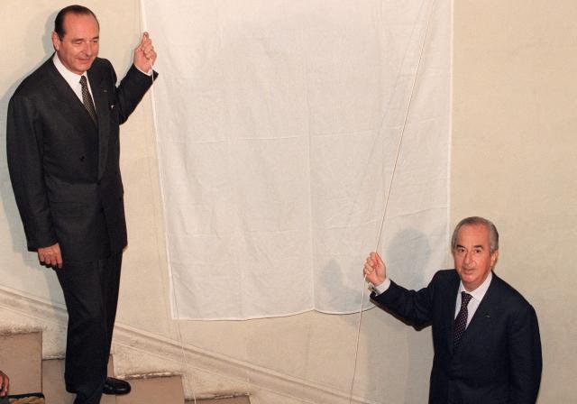 (FILES) French chairman of the neo-gaullist Rally for the Republic Party (Rassemblement pour la République, RPR), Mayor of Paris and future presidential candidate Jacques Chirac (L), and his contender Edouard Balladur, Prime Minister under François Mitterrand, Socialist President of France, unveil a plaque in honour of Dame Marechale Leclerc de Hautecloque 29 November 1994 in Paris. Chirac was elected President of France 07 May 1995 and re-elected 05 May 2002. Former Prime Minister Edouard Balladur died on August 31, 2026 in Paris at the age of 97, his family told AFP. (Photo by GERARD JULIEN / AFP)