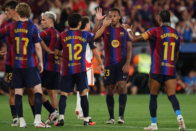 Barcelona's French defender #23 Jules Kounde (2R) celebrates scoring his team's third goal during the Spanish league football match between FC Barcelona and Rayo Vallecano de Madrid at Camp Nou Stadium in Barcelona on August 31, 2026. (Photo by Lluis GENE / AFP)