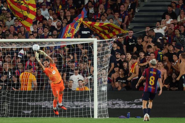 Barcelona's Spanish goalkeeper #01 Joan Garcia makes a save during the Spanish league football match between FC Barcelona and Rayo Vallecano de Madrid at Camp Nou Stadium in Barcelona on August 31, 2026. (Photo by Lluis GENE / AFP)