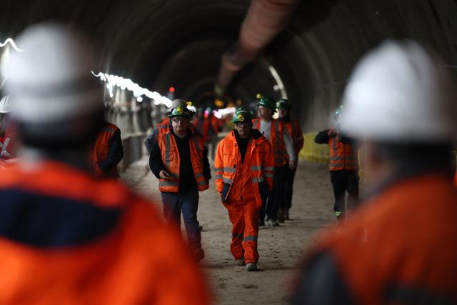 Workers walk at the tunnel meeting construction site for the expansion of Santiago Metro Line 6 in Santiago on August 31, 2026. (Photo by Javier TORRES / AFP)