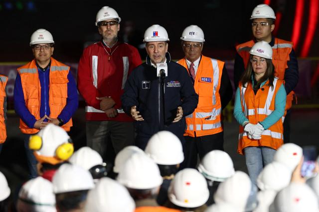 Chile's Transport Minister Louis de Grange (C) speaks to the media at the tunnel meeting for the expansion of Santiago Metro Line 6 in Santiago on August 31, 2026. (Photo by Javier TORRES / AFP)