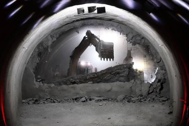 An excavator is pictured at the tunnel meeting construction site for the expansion of Santiago Metro Line 6 in Santiago on August 31, 2026. (Photo by Javier TORRES / AFP)