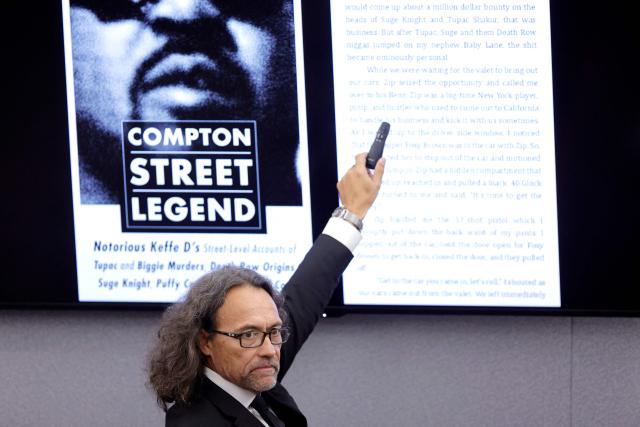 Michael Sanft, defense attorney for Duane Davis, points to an excerpt from a book by Davis, as he makes closing arguments in the Duane Davis murder trial, related to the 1996 killing of rapper Tupac Shakur, at Clark County District Court at the Regional Justice Center in Las Vegas, Nevada, on August 31, 2026. The trial of the former gang leader accused of orchestrating the murder of rapper Tupac Shakur began on August 10, 30 years after one of America's most high-profile unresolved killings. The proceedings, expected to last a month, will likely not make clear who fired the shots that killed the California hip-hop legend on the night of September 7, 1996, while he was in Las Vegas to see a Mike Tyson boxing match. (Photo by STEVE MARCUS / POOL / AFP)