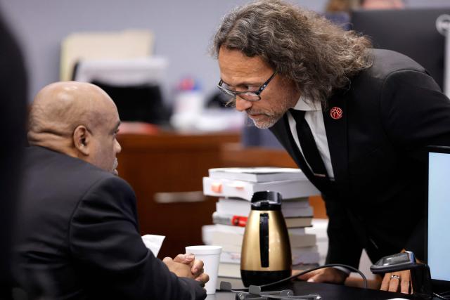 Duane Davis (L) speaks with defense attorney Michael Sanft, during closing arguments in his murder trial, related to the 1996 killing of rapper Tupac Shakur, at Clark County District Court at the Regional Justice Center in Las Vegas, Nevada, on August 31, 2026. The trial of the former gang leader accused of orchestrating the murder of rapper Tupac Shakur began on August 10, 30 years after one of America's most high-profile unresolved killings. The proceedings, expected to last a month, will likely not make clear who fired the shots that killed the California hip-hop legend on the night of September 7, 1996, while he was in Las Vegas to see a Mike Tyson boxing match. (Photo by STEVE MARCUS / POOL / AFP)